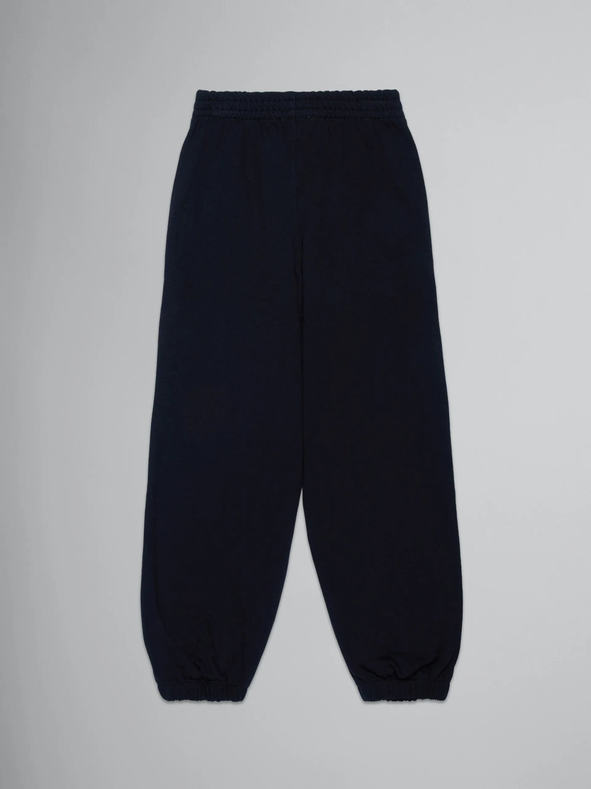 Pantalones holgados negros de felpa con logotipo